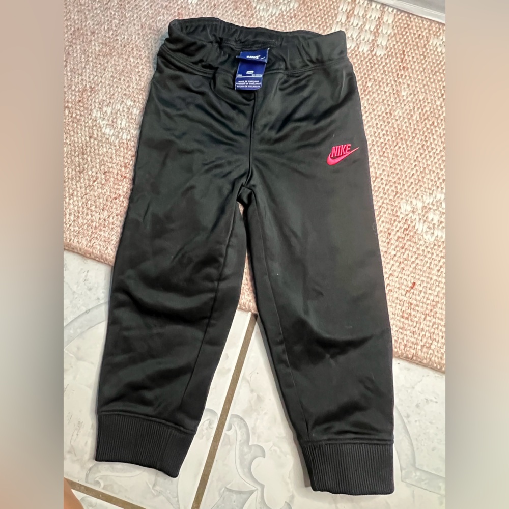 Nike Kids Black Sweatpants with Pink Swoosh